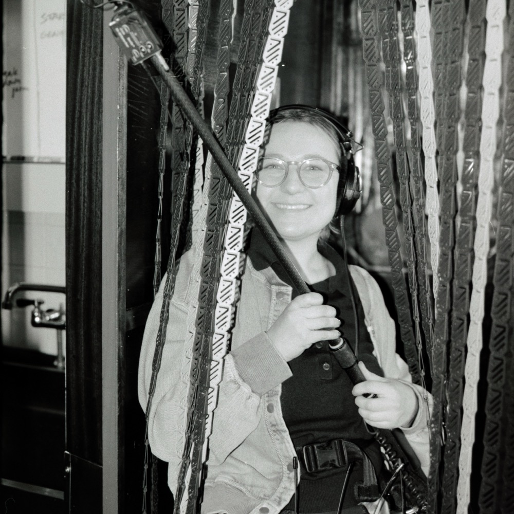 Rachel Suffian on set with a boom mic